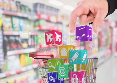 Hand on man putting music icon in shopping cart
