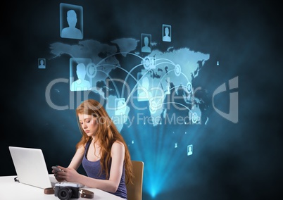 Digital composite image of woman using mobile phone on desk