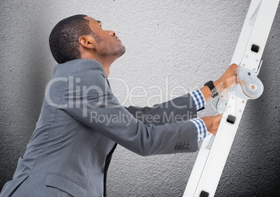 Businessman climbing a ladder against grey background