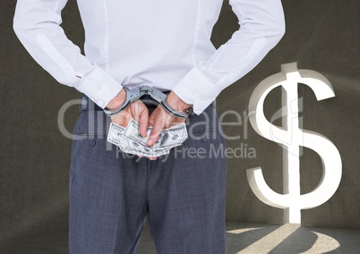 Corrupt businessman in handcuffs holding money against dollar sign