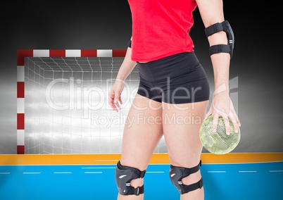 Mid section of female player holding handball
