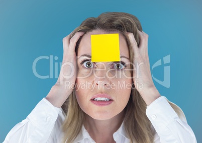 Stressed businesswoman with blank sticky note on forehead