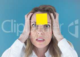 Stressed businesswoman with blank sticky note on forehead