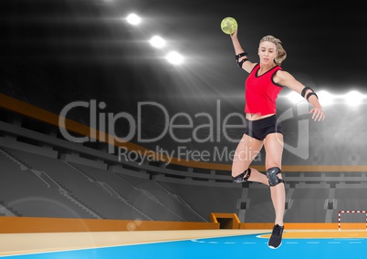 Female athlete playing handball in stadium