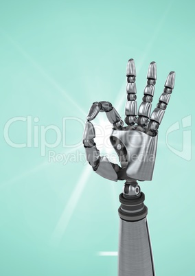 Robot hand showing ok sign against turquoise background