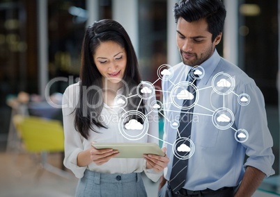 Man and woman using digital tablet and cloud computing interface