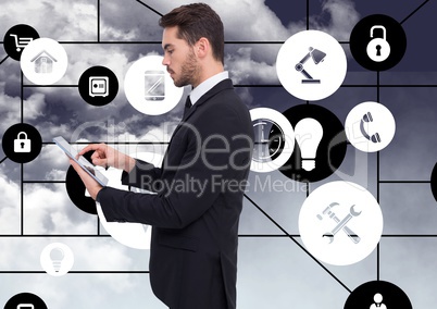 Businessman using digital tablet with connecting icons