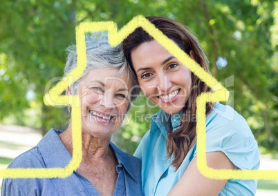 Mother and daughter smiling in the park with house outline