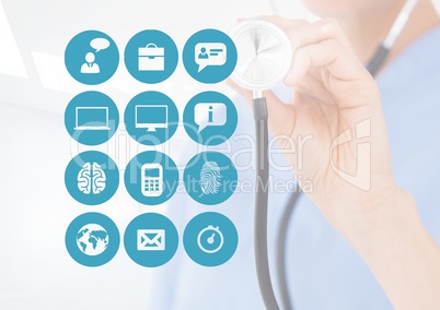 Mid-section of doctor holding stethoscope with application icons on digital screen