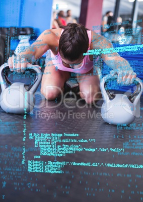 Digital coding screen against a woman working out with kettle bell