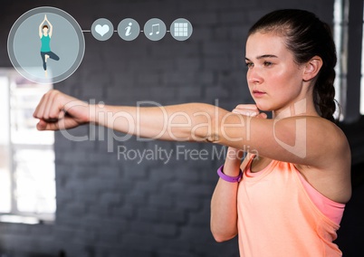 Fit woman practicing with fitness interface