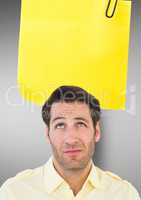 Confused male executive with blank sticky note over head