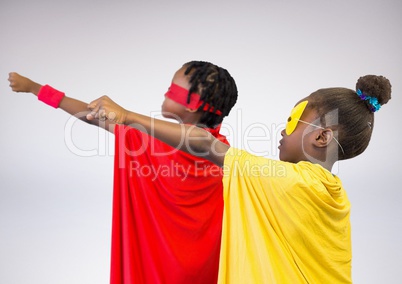 Two children pretending to be a superhero