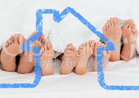 Family sleeping together with house outline