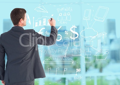 Businessman drawing business symbols against city in background