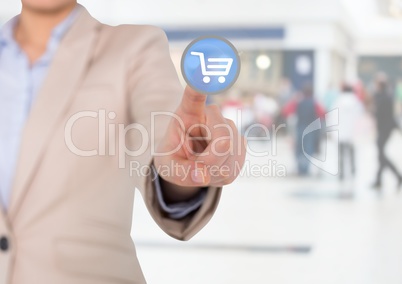 Businesswoman touching interface screen with shopping cart icon