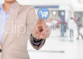 Businesswoman touching interface screen with shopping cart icon