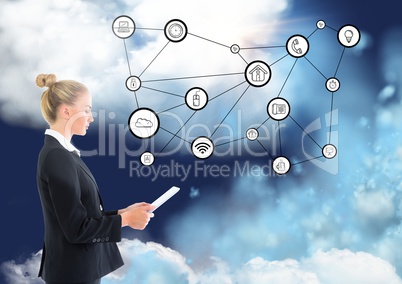 Side view of businesswoman using digital tablet with connecting icons and clouds in background