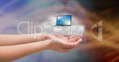 Conceptual image of cupped hands with cloud and laptop