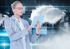 Businesswoman using digital tablet with cloud and binary codes in background