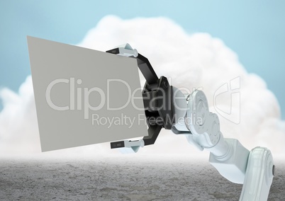 Robot claw holding blank card in front of cloud