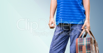 Man carrying a bag against blue background