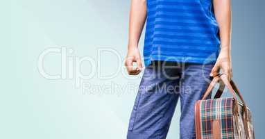 Man carrying a bag against blue background