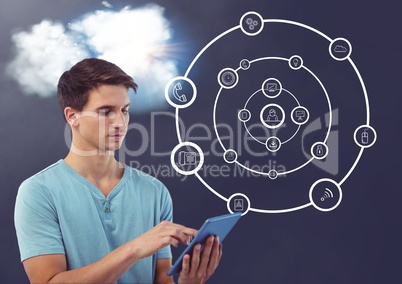 Man using digital tablet with cloud and connecting icons in background