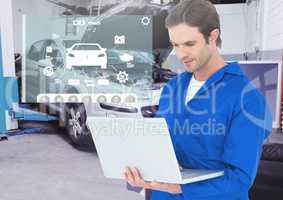 Mechanic using laptop against car mechanics interface in background