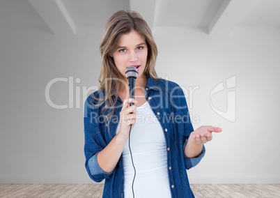 Beautiful woman singing on microphone