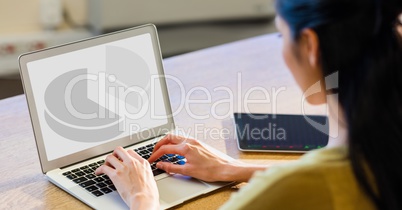 Woman working on laptop at desk