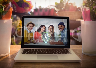 Laptop kept on table with video calling screen