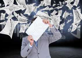 Businessman covering his face with placard with data graphics in background