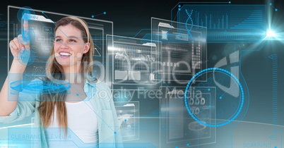 Smiling woman touching digitally futuristic screen