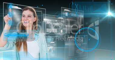 Smiling woman touching digitally futuristic screen