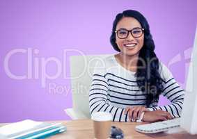 Woman in spectacles sitting on her desk against violet background