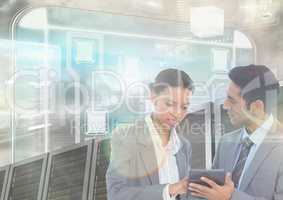 Businesspeople discussing over digital tablet against server background