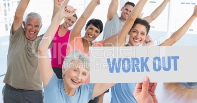Hand holding placard with text work out in aerobics club