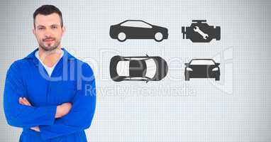 Mechanic standing with arms crossed against car icons in background