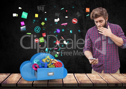 Suprised man using mobile phone against app icons in background