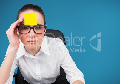 Worried businesswoman with blank sticky note on her forehead