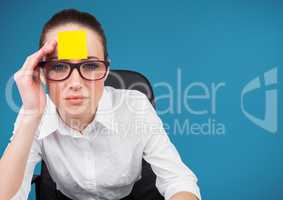 Worried businesswoman with blank sticky note on her forehead