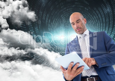 Businessman using digital tablet with binary codes and cloud in background