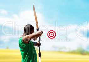 Man aiming with bow and arrow at target