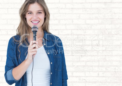 Portrait of beautiful woman singing a song on microphone