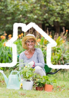Home outline with senior woman gardening in background