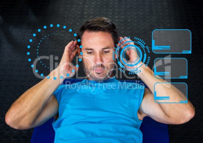 Man exercising against digital interface at gym