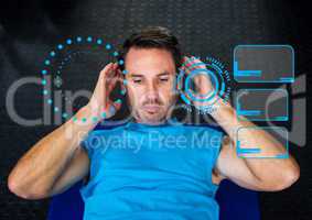 Man exercising against digital interface at gym