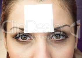 Woman with sticky note stuck on face
