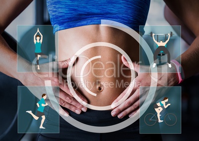 Fit woman showing her abdominal muscles against fitness interface in baackground